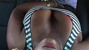 People engage in intense activity inside a car