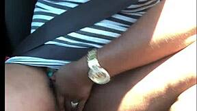 People engage in intense activity inside a car