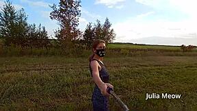 juli smith meow slowly undresses in the outdoor field for voyeurs