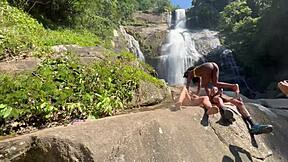 Pretinha gets fucked outdoor at the waterfall