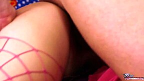 Young student in fishnets awaits something in scene