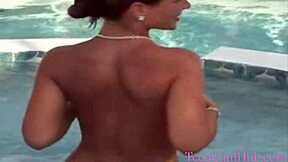 Teen model teases with big tits in bikini by pool