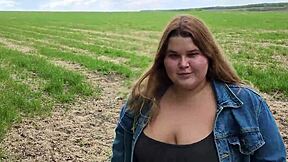 Cute chubby teen sucks cock with drool in open field