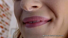 Perky Maya handles huge black anaconda with ease