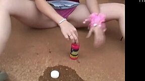 Kitty Karsen plays with bubbles nude, showing her tits and fingering pussy.