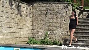 brunette plays with her lusty body outdoors in public