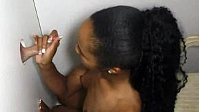 ebony hottie blows strangers through glory hole.