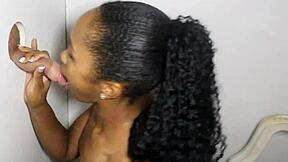 ebony hottie blows strangers through glory hole.