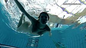 Gazel Podvodkova strips naked underwater at public pool.