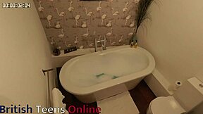 British teen plays with dildo in steamy bath session