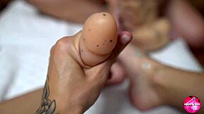 Two CUTIES with SHINY LEGS PLAY with HUGE RUBBER COCK in FOOTJOB fun.