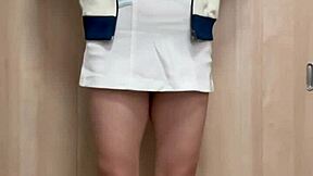 Girls in tennis costumes tease their asses playfully