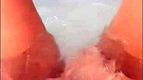 Pretty woman masturbates in hot tub, loud cumshot finale