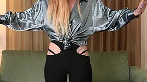 Hazel Ash models a shiny shirt paired with tight leggings for the camera