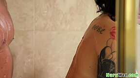 Brunette busty teen 18+ masseuse prepares client for nuru massage in shower
