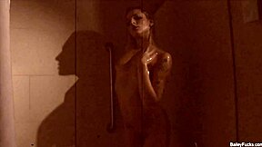 Dahlia Sky enjoys naughty solo masturbation in the shower, showing tits and ass.