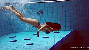 Martina shows off her blue bikini underwater