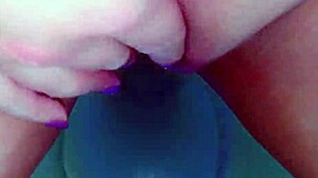 A cute latina babe engages in private activity in a public restroom, captured on hidden camera.