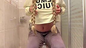 HORNY BLONDE LIL ROSE SQUIRTS IN COLLEGE BATHROOM, BIG TITS ON DISPLAY