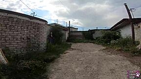 the horny student with long hair and brown eyes gives a sloppy blowjob behind the garages