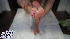 Look at this brunette showing her oiled feet in close-up foot fetish!