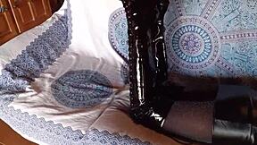 brunette milf in total black fishnets and over-the-knee boots