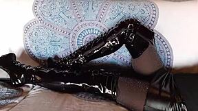 brunette milf in total black fishnets and over-the-knee boots