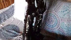 brunette milf in total black fishnets and over-the-knee boots