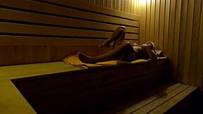 Caught on hidden cam, girl fingers herself in sauna at night