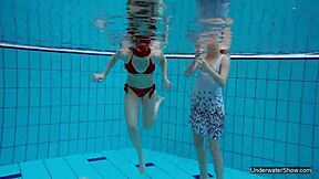 two hot lesbians splashing in the pool 😍