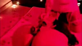 chubby brunette sits for big black dick in red light scene.