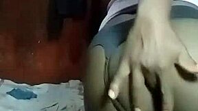 kenyan crossdresser strips and relaxes at home.