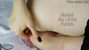 cosplay girl with colored hair in panties upskirt, preparing for anal experience with toys.