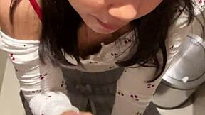 18-year-old asian girl gives blowjob in public restroom, ending with huge cumshot on her face