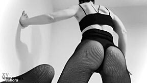 petite german brunette teases in fishnet tights and leggings