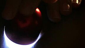 sleepless girl rubs her clit at night with a hand held light on the bed