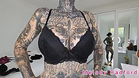 Melody Radford tries on black and purple lingerie and micro bikini in detailed haul