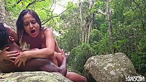 Fucking passionately in the waterfall with big tits Asian