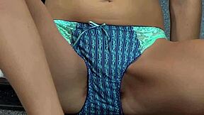 Slim teen fingers her hairy pussy in lingerie and heels while alone at home.