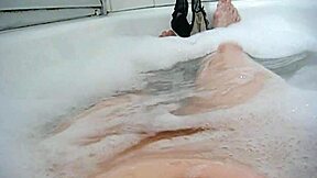 annie enjoys a comfy bubble bath with her body and monster toys