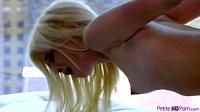 Petite blonde in thong and heels shows hairless pussy.