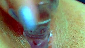 Girl's puffy pussy meets glass dildo for sensual orgasm