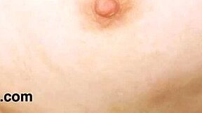 Lovely brunette beauty poses on sofa to reveal her stunning figure.