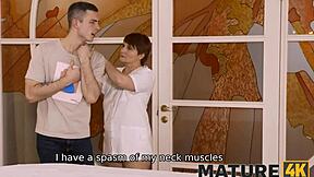 After a tough day at the office, this young stud unwinds with a steamy session from the chubby redhead masseuse.