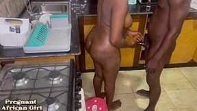 Black pregnant girl bent over and fucked in kitchen with cum on ass