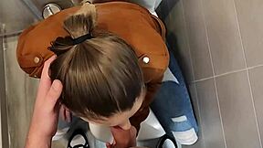 Hey, check this cute blonde with big tits giving a blowjob in university bathroom 😏