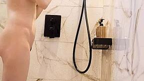 Bathing black-haired Japanese girl with ponytail and small tits