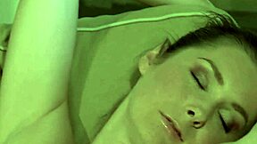 An unidentified person appears in a bathing scene involving old and young individuals in the shower.