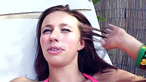 these cute teen lesbians splash around in the swimming pool. they share close moments together afterward