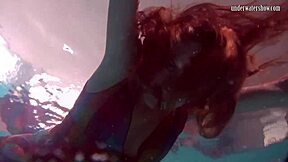 uh, redhead b nikita vodorezova strips naked real quick underwater at the beach or pool... like super fast ya know?
